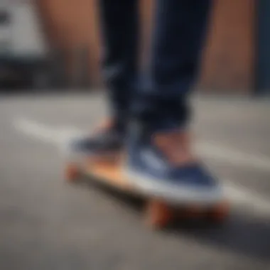 Dynamic shot of navy blue and orange Vans on a skateboard