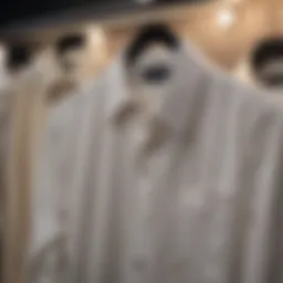 Elegant cream button-down shirt displayed on a hanger