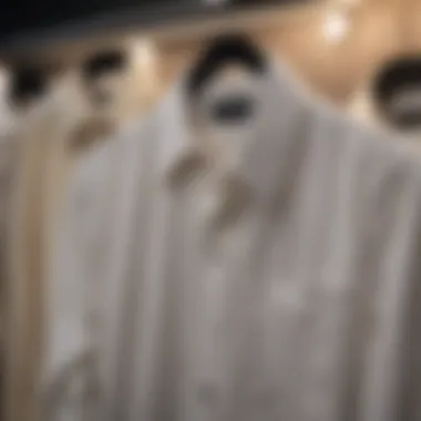 Elegant cream button-down shirt displayed on a hanger