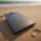 A vintage boogie board on a sandy beach, illustrating its historical significance.