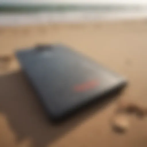 A vintage boogie board on a sandy beach, illustrating its historical significance.
