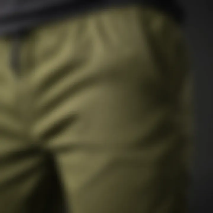Close-up of olive green joggers highlighting fabric texture and durability