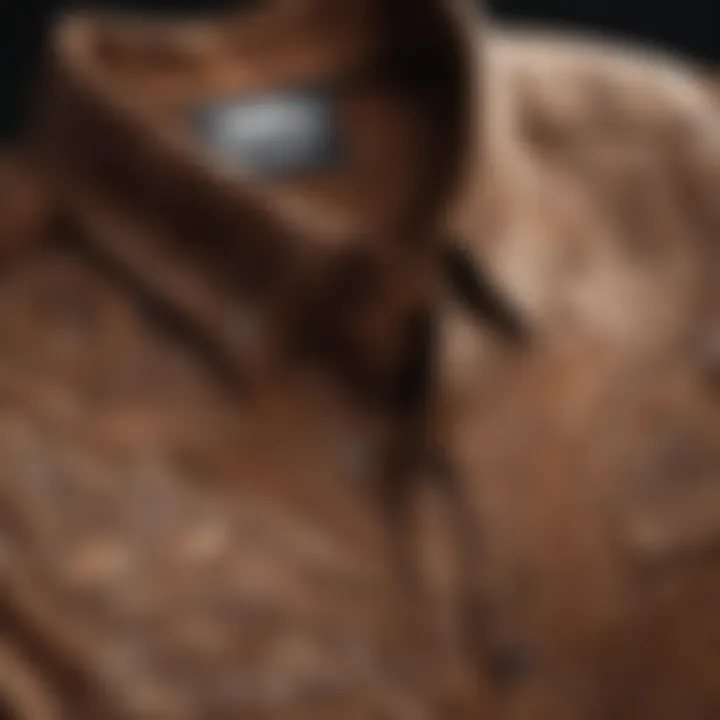 Close-up of the intricate graphic design on a brown shirt, highlighting the artistic elements significant to sport enthusiasts.