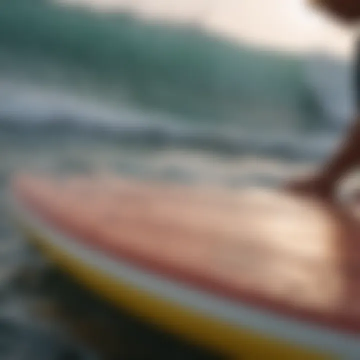 Wax scraper being used on a surfboard