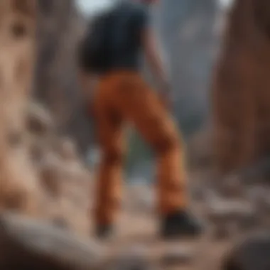 Active individual wearing Y&R cargo pants during rock climbing